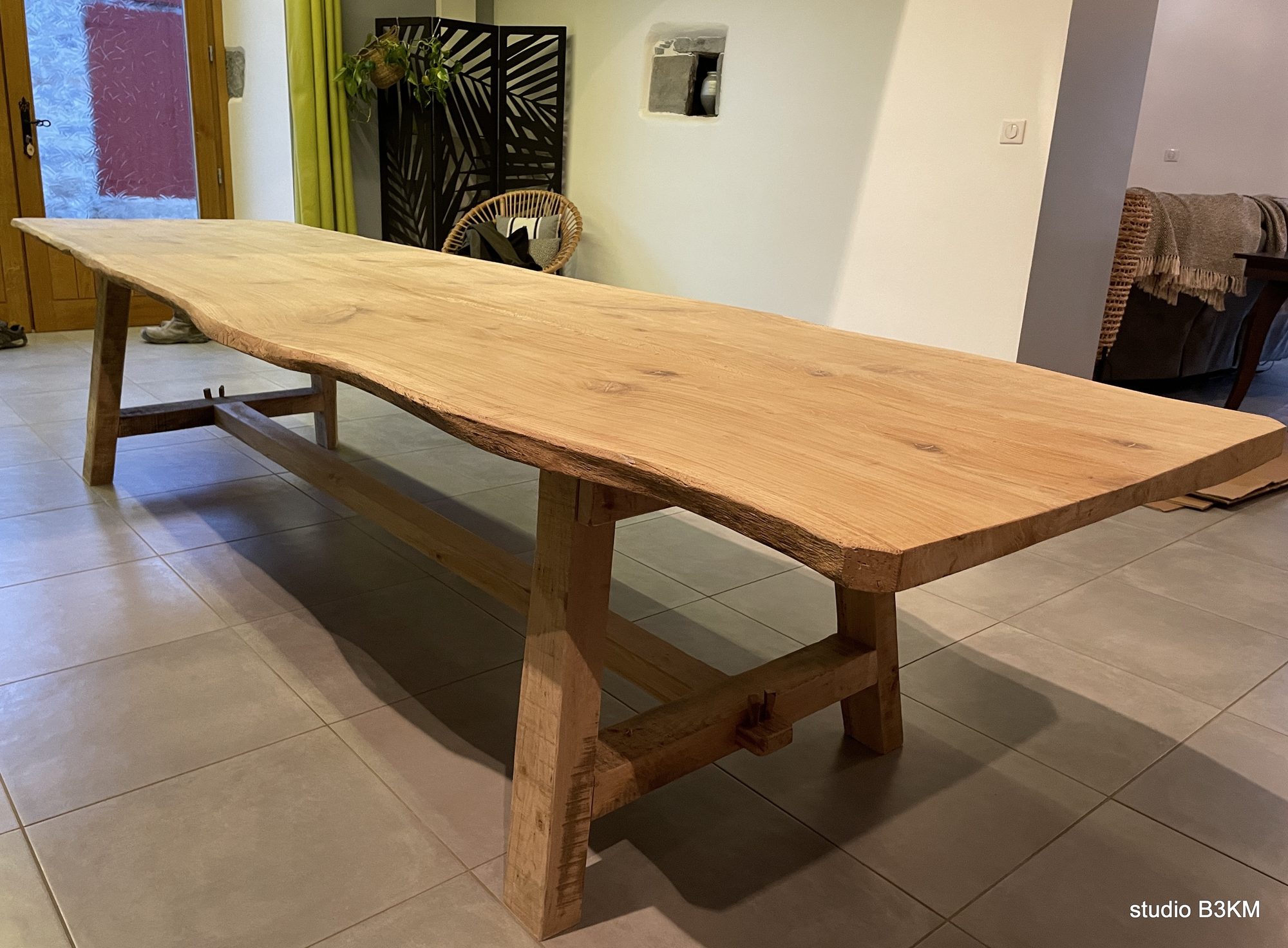 Live-edge oak dining table by B3KM EcoDesign